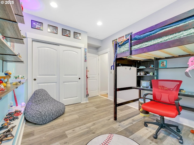 104 S Pl, Astoria, OR 97103 - bedroom with an office area, wood finished floors, a closet, and recessed lighting
