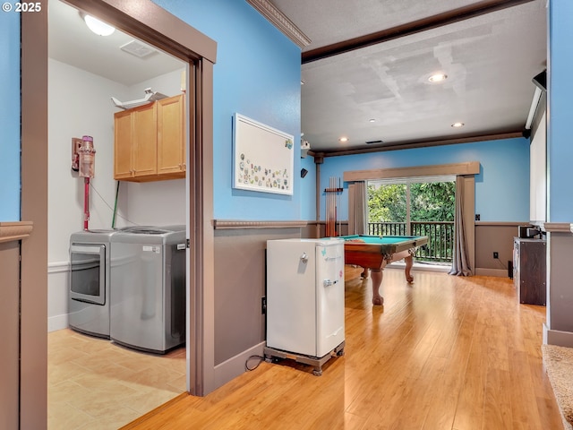 104 S Pl, Astoria, OR 97103 - washroom with washing machine and clothes dryer, billiards, cabinet space, crown molding, and recessed lighting