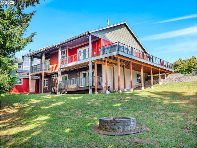 104 S Pl, Astoria, OR 97103 - rear view of property with an outdoor fire pit, a lawn, and a wooden deck