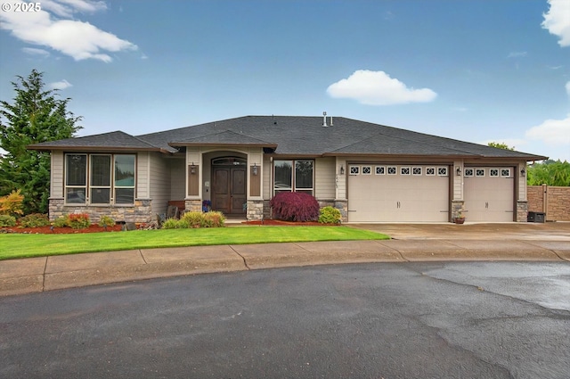 16215 NE 171st Ct, Brush Prairie, WA 98606 - prairie-style house with stone siding, an attached garage, concrete driveway, a front lawn, and roof with shingles