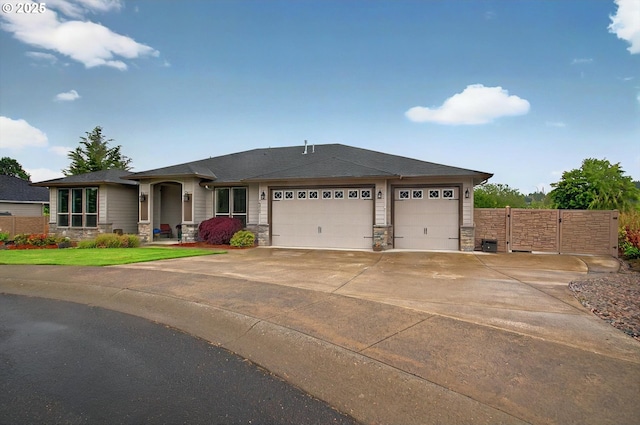 16215 NE 171st Ct, Brush Prairie, WA 98606 - view of front of house with stone siding, a garage, and concrete driveway