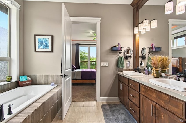 16215 NE 171st Ct, Brush Prairie, WA 98606 - full bath with ensuite bathroom, double vanity, a garden tub, and plenty of natural light