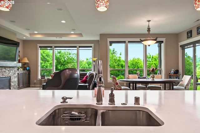 16215 NE 171st Ct, Brush Prairie, WA 98606 - kitchen featuring a sink, open floor plan, a fireplace, recessed lighting, and decorative light fixtures