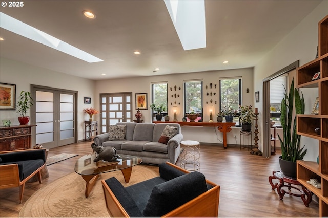 1342 11th St SW, Bandon, OR 97411 - living area with a skylight, wood finished floors, recessed lighting, and french doors