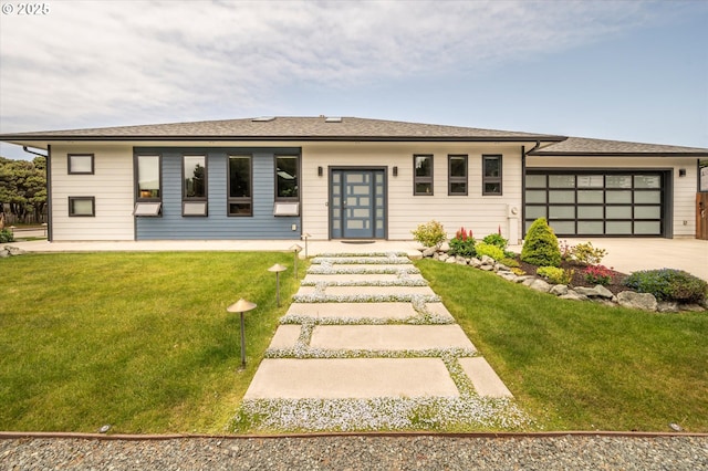1342 11th St SW, Bandon, OR 97411 - view of front of house with concrete driveway, a front yard, and an attached garage