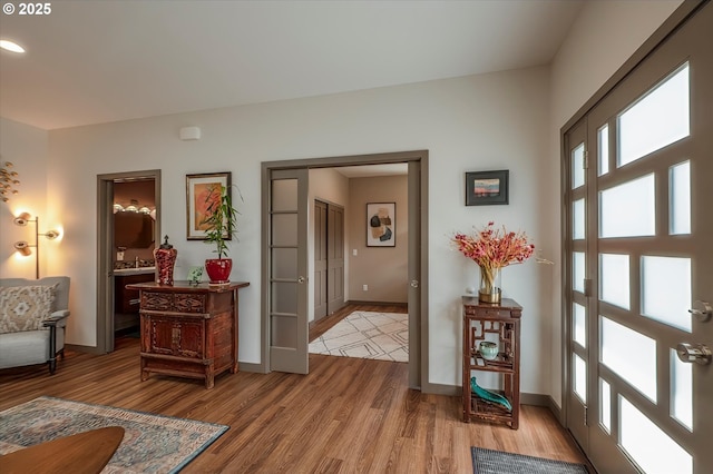 1342 11th St SW, Bandon, OR 97411 - entrance foyer with wood finished floors and recessed lighting
