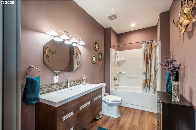 1342 11th St SW, Bandon, OR 97411 - bathroom featuring vanity, wood finished floors, shower / tub combo, and tasteful backsplash
