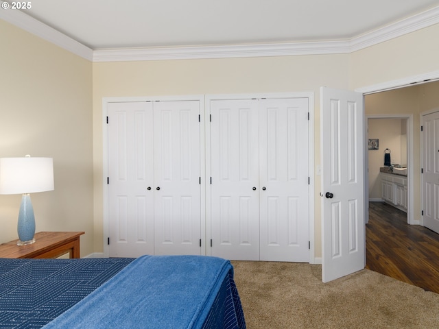 54179 Gould Rd, Bandon, OR 97411 - carpeted bedroom with ornamental molding, multiple closets, and baseboards