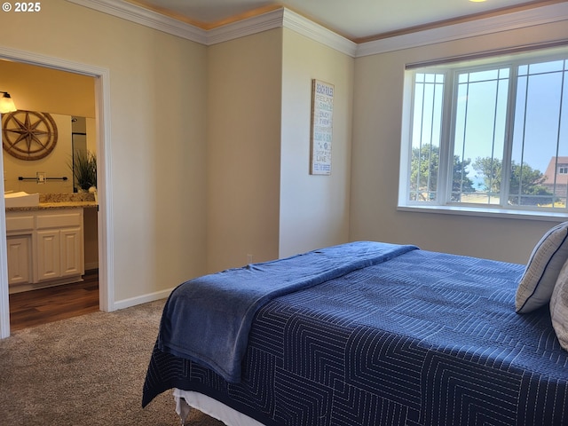 54179 Gould Rd, Bandon, OR 97411 - carpeted bedroom featuring crown molding, connected bathroom, and baseboards