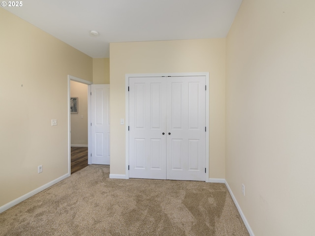 54179 Gould Rd, Bandon, OR 97411 - unfurnished bedroom featuring carpet floors, baseboards, and a closet