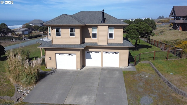 54179 Gould Rd, Bandon, OR 97411 - view of front of property with a garage, driveway, roof with shingles, and a water view