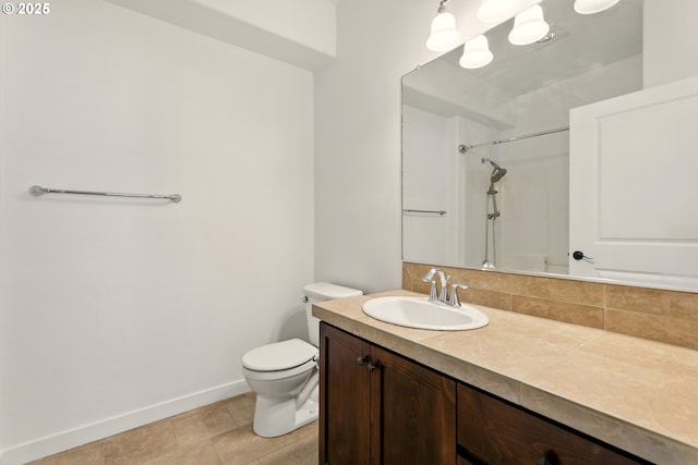 672 NE Newstead Ln, Hillsboro, OR 97006 - full bath with toilet, vanity, baseboards, a shower, and tile patterned flooring