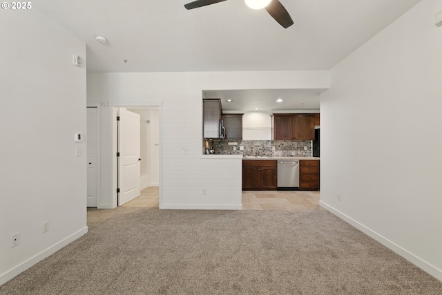 672 NE Newstead Ln, Hillsboro, OR 97006 - unfurnished living room featuring light carpet, a ceiling fan, baseboards, and recessed lighting
