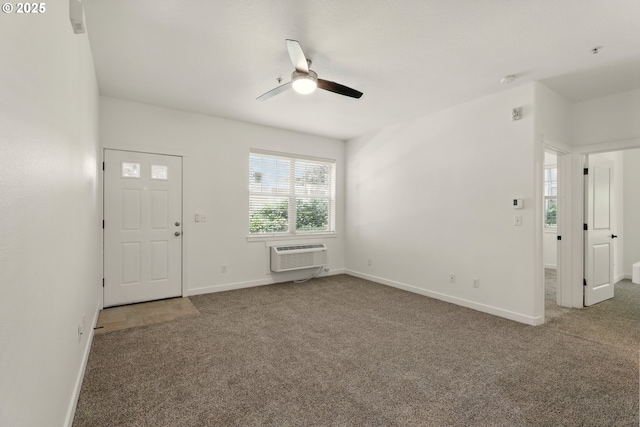 672 NE Newstead Ln, Hillsboro, OR 97006 - carpeted empty room with a ceiling fan, a wall mounted air conditioner, and baseboards