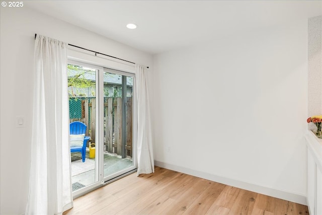 7143 SW Sagert St Unit 106, Tualatin, OR 97062 - doorway to outside with light wood-type flooring, baseboards, and recessed lighting