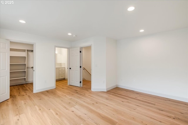 7143 SW Sagert St Unit 106, Tualatin, OR 97062 - hall with an AC wall unit, light wood finished floors, and recessed lighting