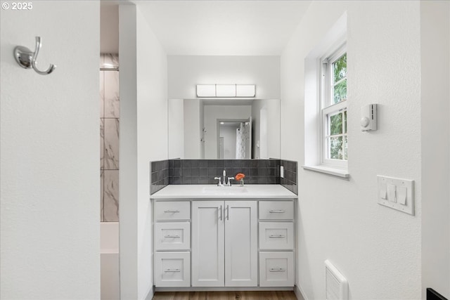 7143 SW Sagert St Unit 106, Tualatin, OR 97062 - empty room with a wall mounted air conditioner, light wood-style flooring, recessed lighting, baseboards, and a sink