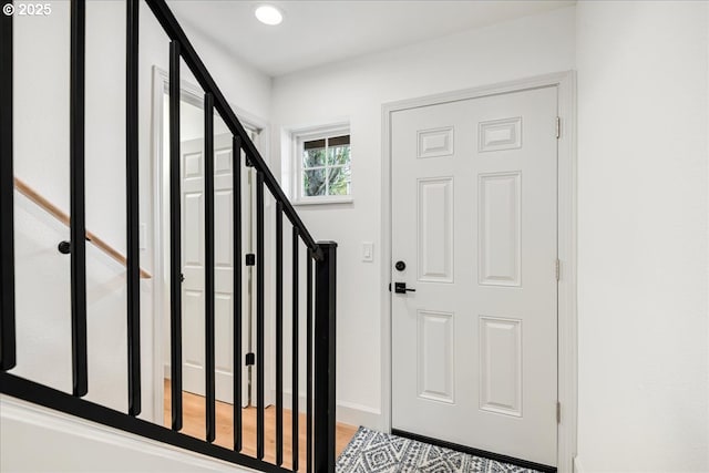 7143 SW Sagert St Unit 106, Tualatin, OR 97062 - foyer with baseboards, light wood-style flooring, stairway, and recessed lighting