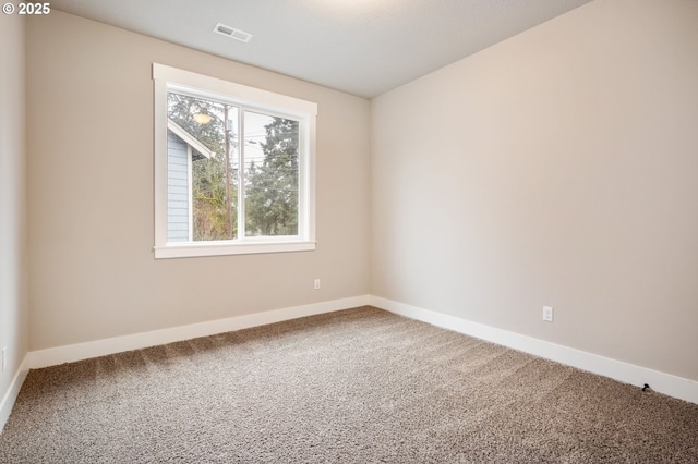 spare room with carpet floors