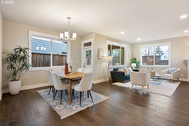 dining room featuring dark wood-type flooring and a chandelier