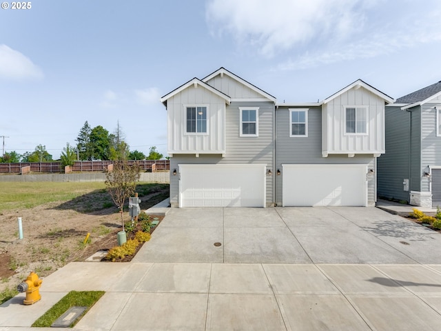 736 NW 178th Way, Ridgefield, WA 98642 - view of front of property with board and batten siding, a garage, and concrete driveway