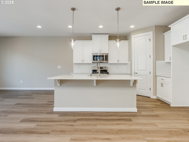 736 NW 178th Way, Ridgefield, WA 98642 - kitchen featuring appliances with stainless steel finishes, baseboards, light countertops, tasteful backsplash, and recessed lighting