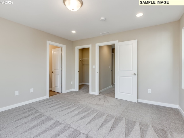 736 NW 178th Way, Ridgefield, WA 98642 - unfurnished bedroom with carpet flooring, baseboards, a spacious closet, and recessed lighting