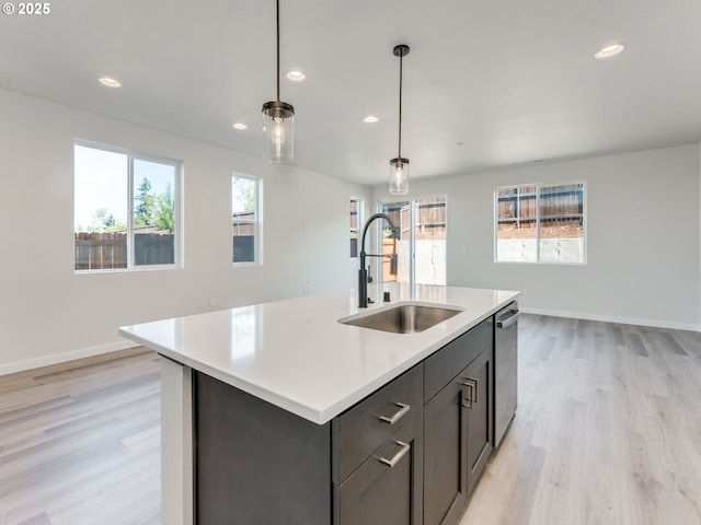 736 NW 178th Way, Ridgefield, WA 98642 - kitchen with dishwasher, light wood-style flooring, recessed lighting, light countertops, and pendant lighting