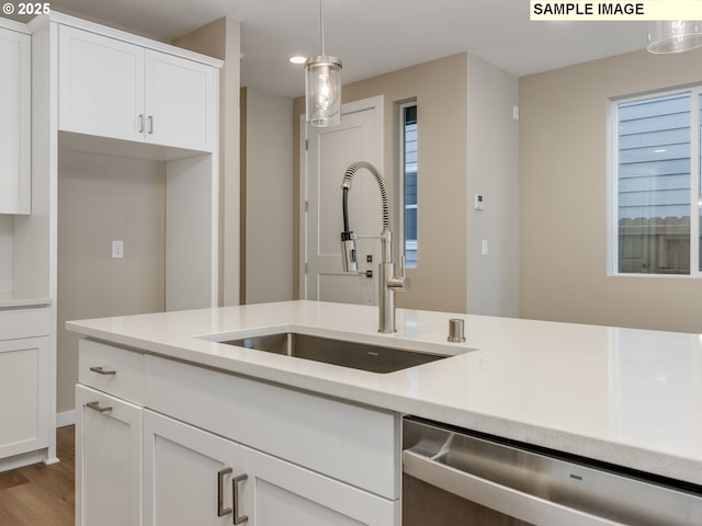 736 NW 178th Way, Ridgefield, WA 98642 - kitchen with dishwasher, a sink, light countertops, and wood finished floors