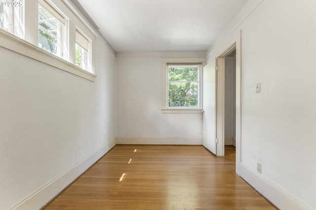 1904 SE Alder St, Portland, OR 97214 - spare room featuring healthy amount of natural light, light wood-style floors, and baseboards