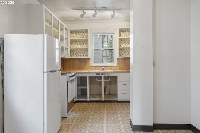 1904 SE Alder St, Portland, OR 97214 - kitchen featuring white appliances, a sink, open shelves, light countertops, and light flooring