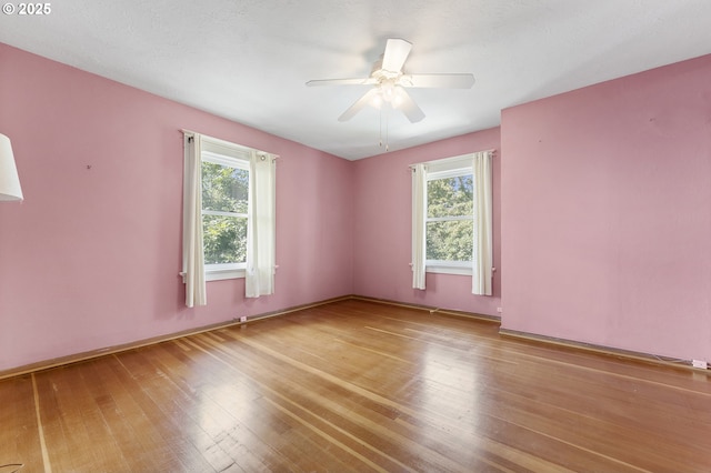 1904 SE Alder St, Portland, OR 97214 - unfurnished room featuring plenty of natural light, ceiling fan, and wood finished floors