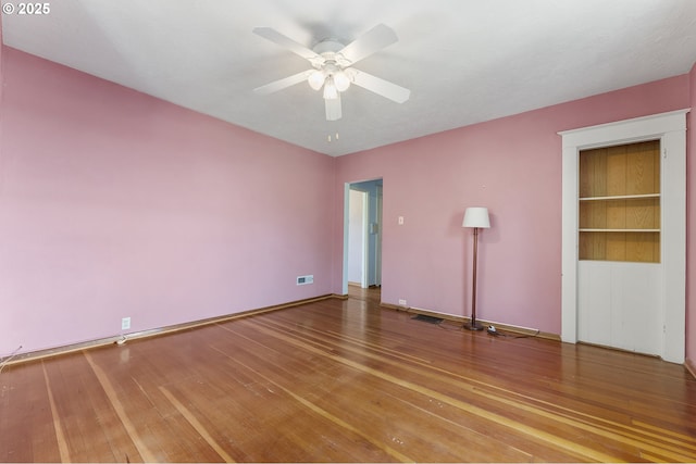 1904 SE Alder St, Portland, OR 97214 - unfurnished bedroom with wood finished floors, ceiling fan, and baseboards