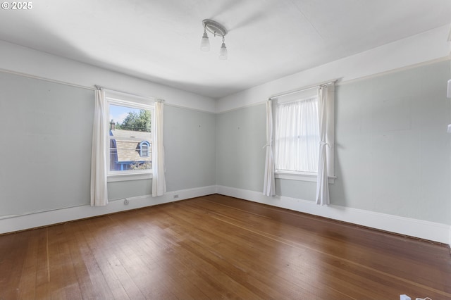 1904 SE Alder St, Portland, OR 97214 - unfurnished room featuring wood-type flooring and baseboards