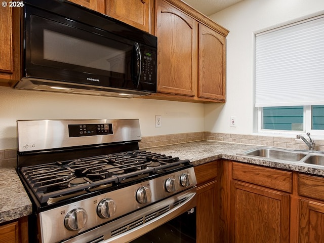 kitchen with sink and stainless steel range with gas stovetop