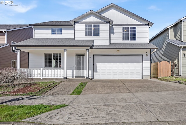 13007 SE Raymond Ct, Portland, OR 97236 - view of front of property with covered porch, driveway, an attached garage, roof with shingles, and board and batten siding