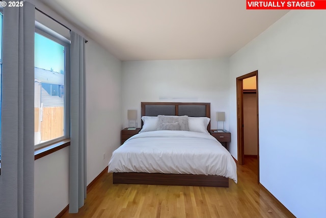 13007 SE Raymond Ct, Portland, OR 97236 - bedroom featuring light wood-style flooring and multiple windows