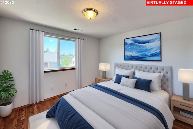 13007 SE Raymond Ct, Portland, OR 97236 - bedroom with wood finished floors and baseboards