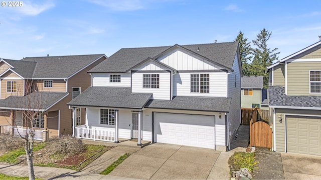 13007 SE Raymond Ct, Portland, OR 97236 - traditional home with a porch, concrete driveway, a garage, board and batten siding, and roof with shingles