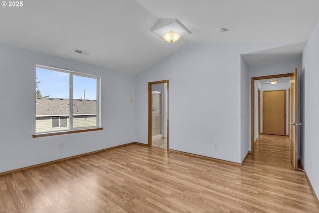13007 SE Raymond Ct, Portland, OR 97236 - unfurnished room with light wood-style flooring, vaulted ceiling, baseboards, and a smoke detector