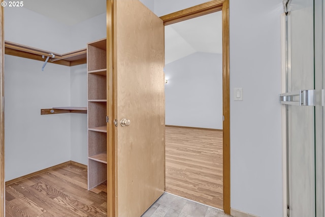 13007 SE Raymond Ct, Portland, OR 97236 - walk in closet with wood finished floors
