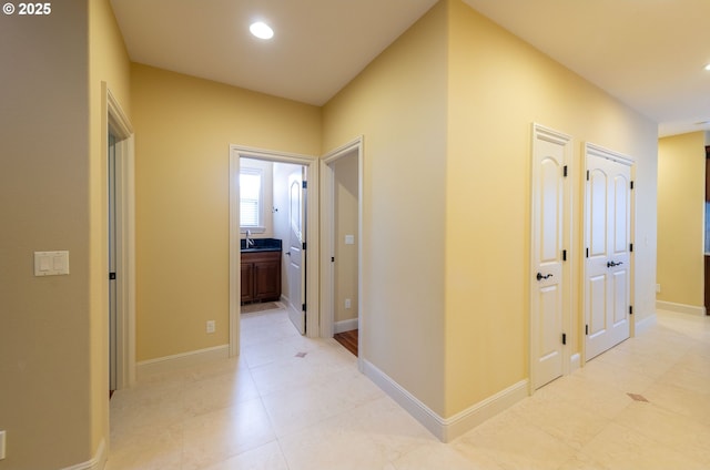 703 SE Keel Ave, Lincoln City, OR 97367 - hallway with recessed lighting, a sink, and baseboards