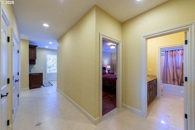 703 SE Keel Ave, Lincoln City, OR 97367 - hall with recessed lighting, light tile patterned flooring, a sink, and baseboards