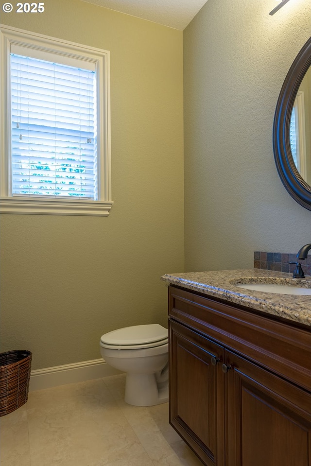 703 SE Keel Ave, Lincoln City, OR 97367 - bathroom featuring toilet, baseboards, vanity, and tile patterned floors