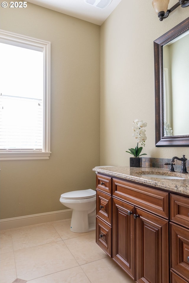 703 SE Keel Ave, Lincoln City, OR 97367 - half bath featuring toilet, vanity, baseboards, and tile patterned floors