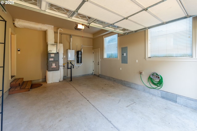 703 SE Keel Ave, Lincoln City, OR 97367 - garage with heating unit, electric panel, baseboards, and a garage door opener