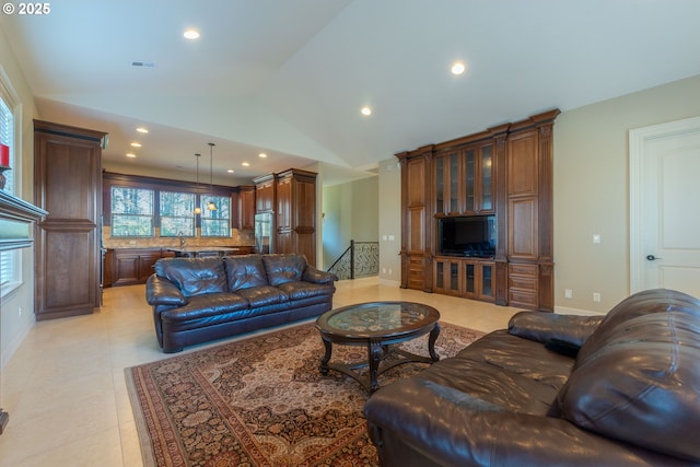 703 SE Keel Ave, Lincoln City, OR 97367 - living room featuring lofted ceiling, baseboards, visible vents, and recessed lighting