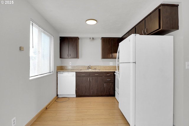 522 River Loop Unit 2, Eugene, OR 97404 - kitchen featuring white appliances, dark brown cabinets, and light wood-type flooring