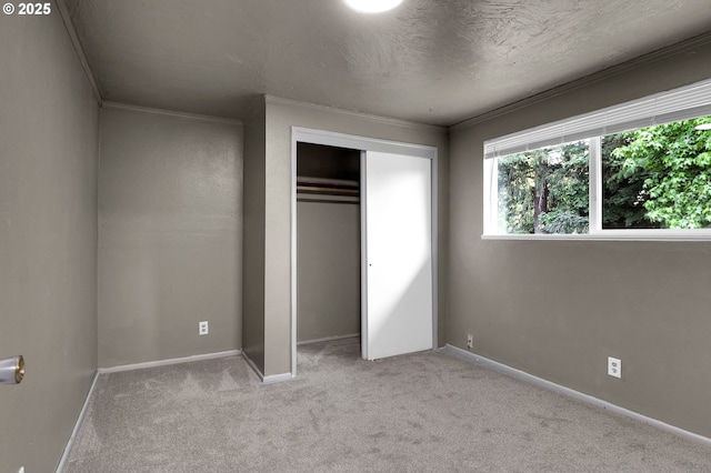 522 River Loop Unit 2, Eugene, OR 97404 - unfurnished bedroom with carpet floors, ornamental molding, and a closet