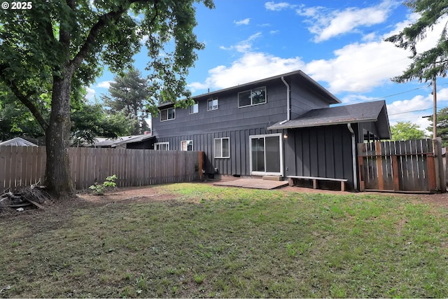 522 River Loop Unit 2, Eugene, OR 97404 - back of house with board and batten siding and a fenced backyard